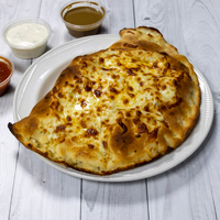 Livi Express golden-brown baked calzone with a melted cheese topping in Livingston.