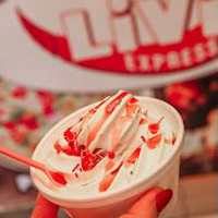  Livi Express Vanilla ice cream in a tub with red strawberry sauce in Livingston.